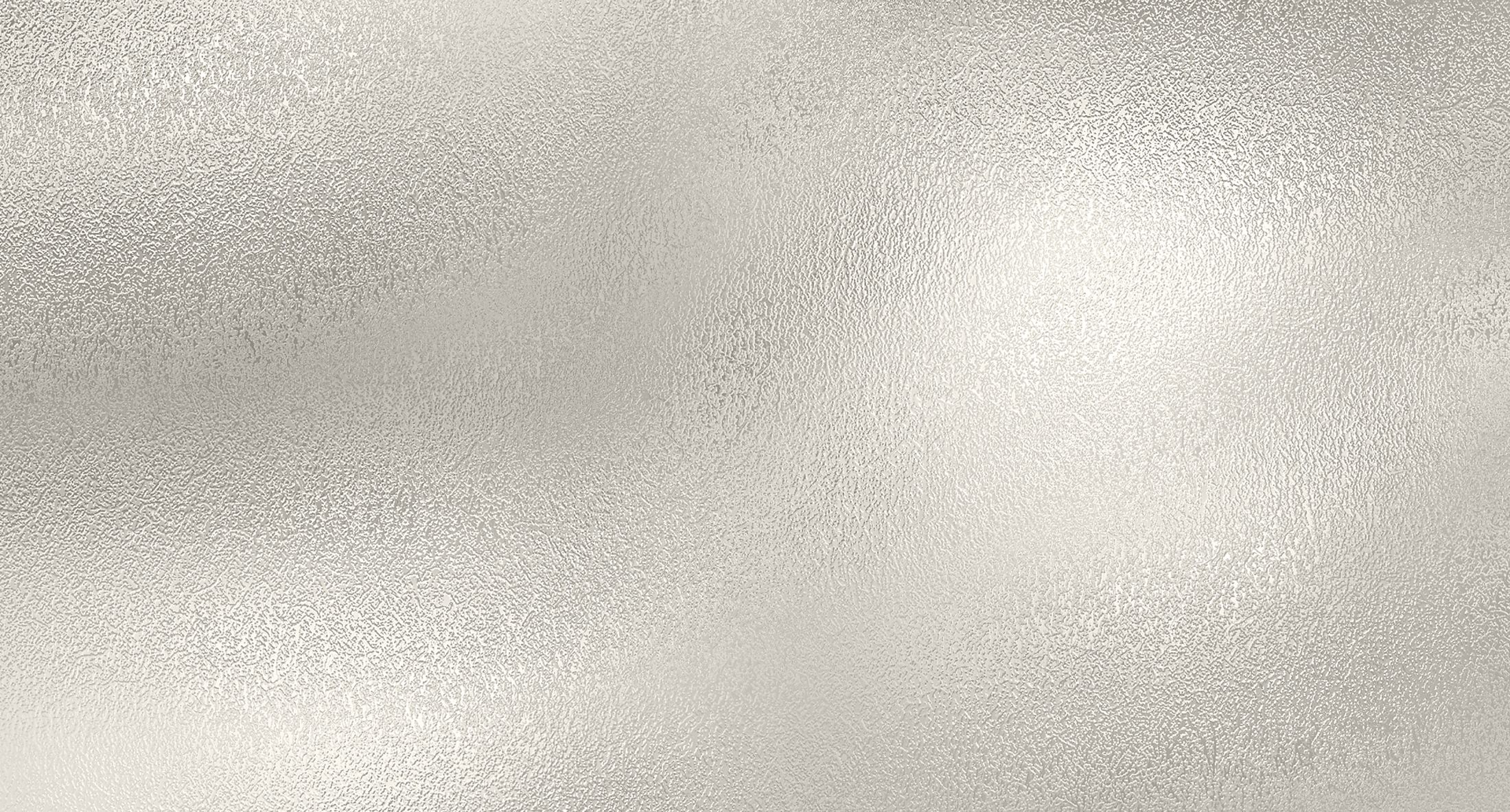 Textured metallic background in soft silver tones.