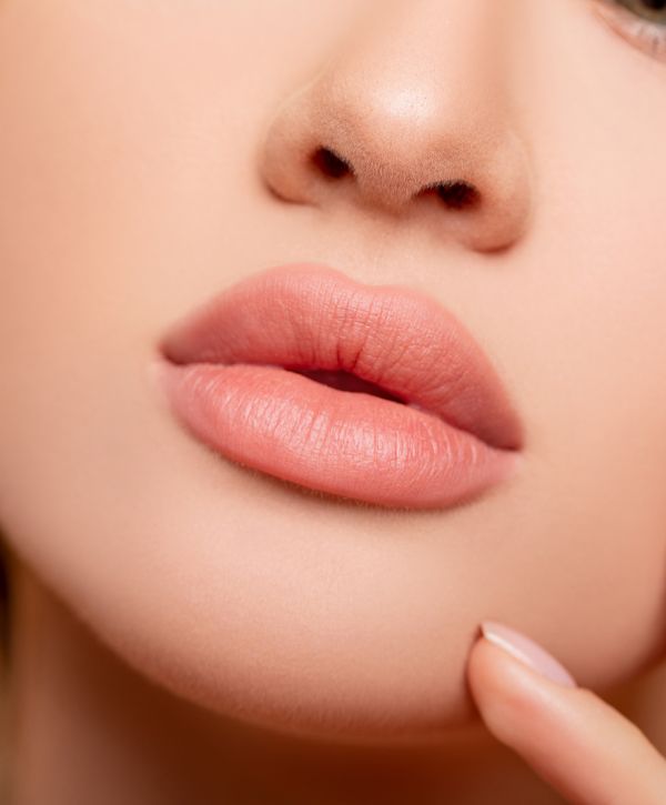 manhattan dermal fillers model with finger on chin
